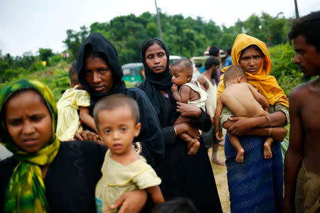 Rohingya refugees stand on the road side near the Balukhali makeshift refugee camp, in Cox’s Bazar, Bangladesh, September 4, 2017. REUTERS/Mohammad Ponir Hossain