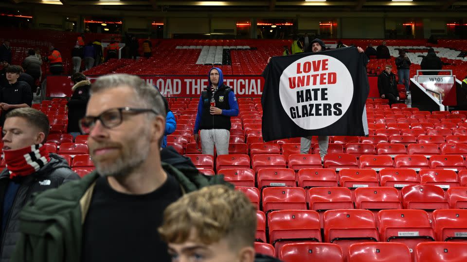 A Manchedster United fan holds an anti-Glazer banner during the Carabao Cup fourth round match against Newcastle United at Old Trafford. - Michael Regan/Getty Images Europe/Getty Images