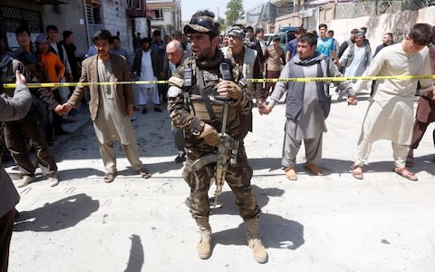 An Afghan security forces mamber stands guard - Credit: REUTERS/Omar Sobhani 