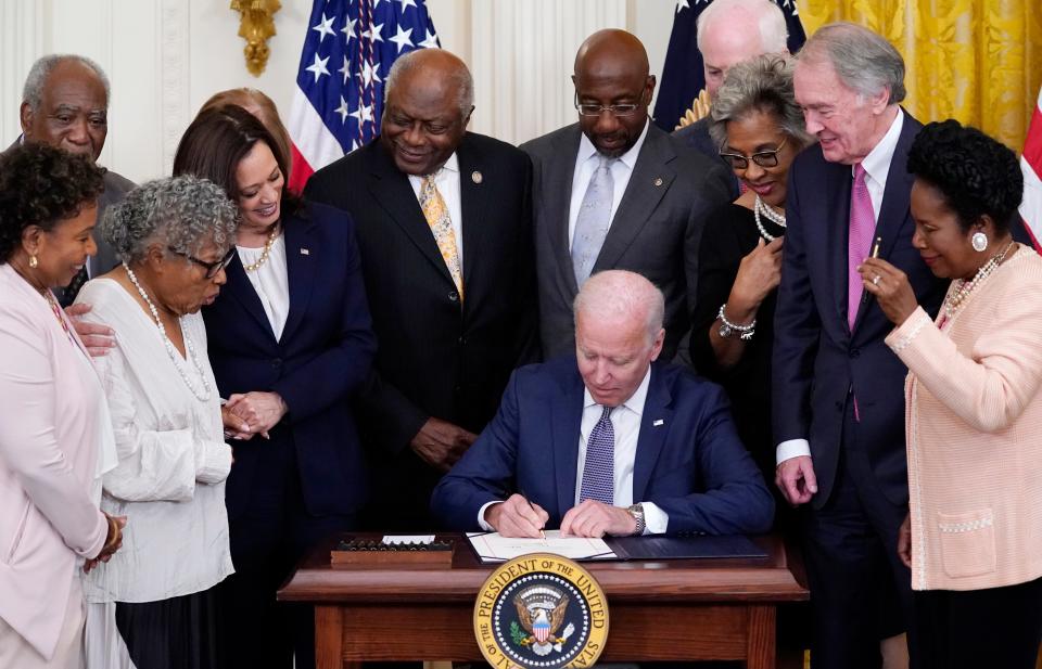 President Joe Biden signs the Juneteenth National Independence Day Act on June 17, 2021.