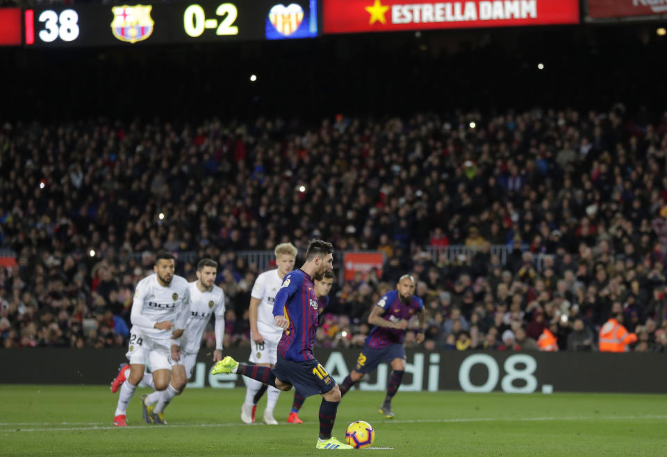 FC Barcelona's Lionel Messi kicks the ball to score a penalty kick during the Spanish La Liga soccer match between FC Barcelona and Valencia at the Camp Nou stadium in Barcelona, Spain, Saturday, Feb. 2, 2019. (AP Photo/Manu Fernandez)