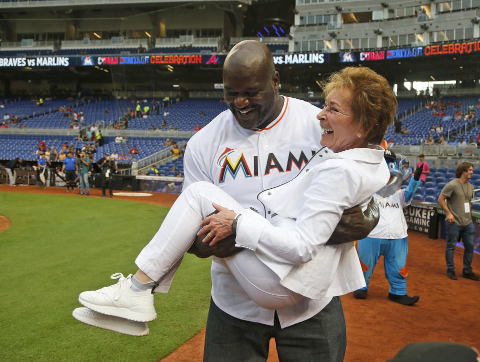 Shaquille O’Neal and Judge Judy: MLB’s newest power couple. (AP Photo)