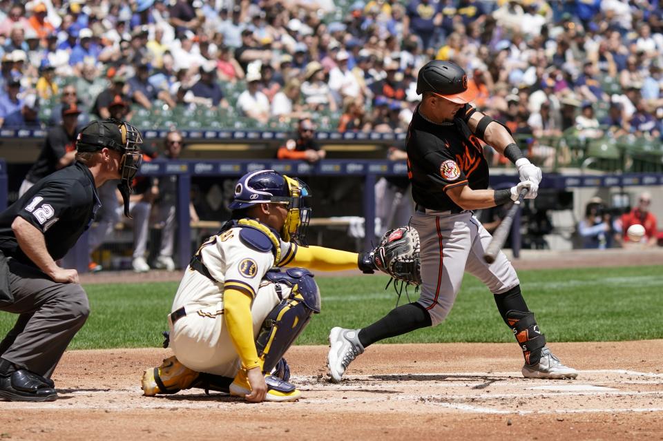 Baltimore Orioles' Ramon Urias hits a double during the third inning of a baseball game against the Milwaukee Brewers Thursday, June 8, 2023, in Milwaukee. (AP Photo/Morry Gash)