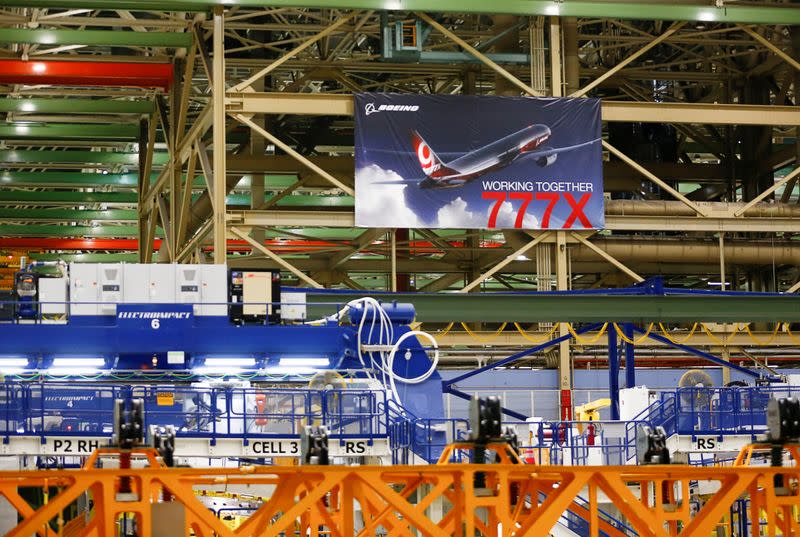 FILE PHOTO: A large 777X banner is seen hanging over the Boeing 777X Final Assembly Building floor during a media tour of Boeing production facilities in Everett