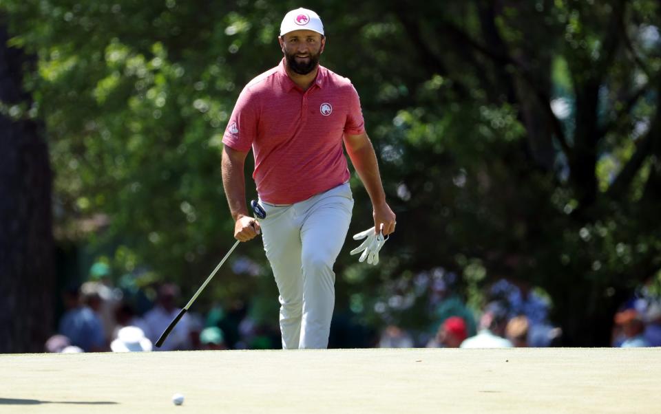 Jon Rahm walking onto the third green