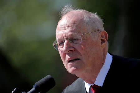 Supreme Court Associate Justice Anthony Kennedy speaks during a swearing in ceremony for Judge Neil Gorsuch as an associate justice of the Supreme Court in the Rose Garden of the White House in Washington, U.S.on April 10, 2017. REUTERS/Carlos Barria/Files