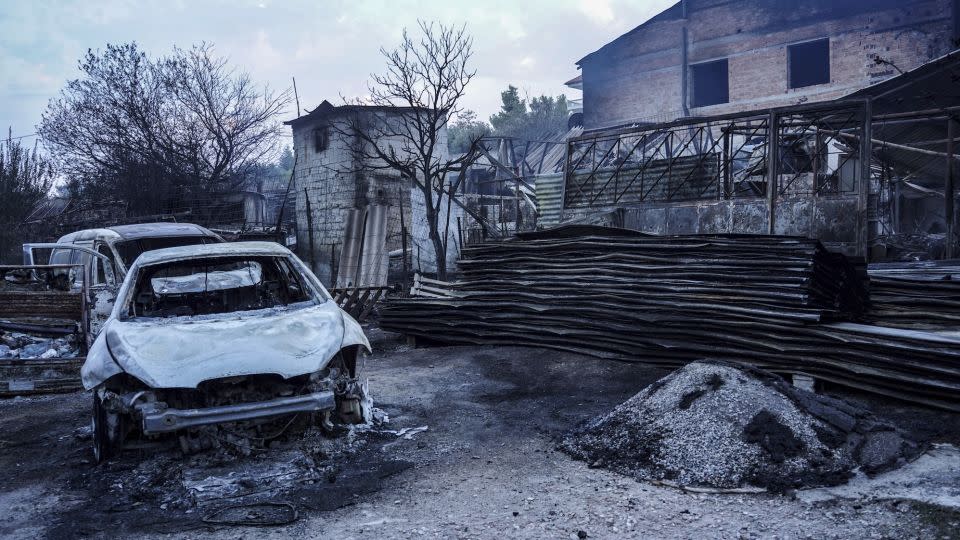 Burning cars destroyed by the fire on Mount Parnitha in Athens, Greece, on August 23, 2023. - Giorgos Arapekos/NurPhoto/AP