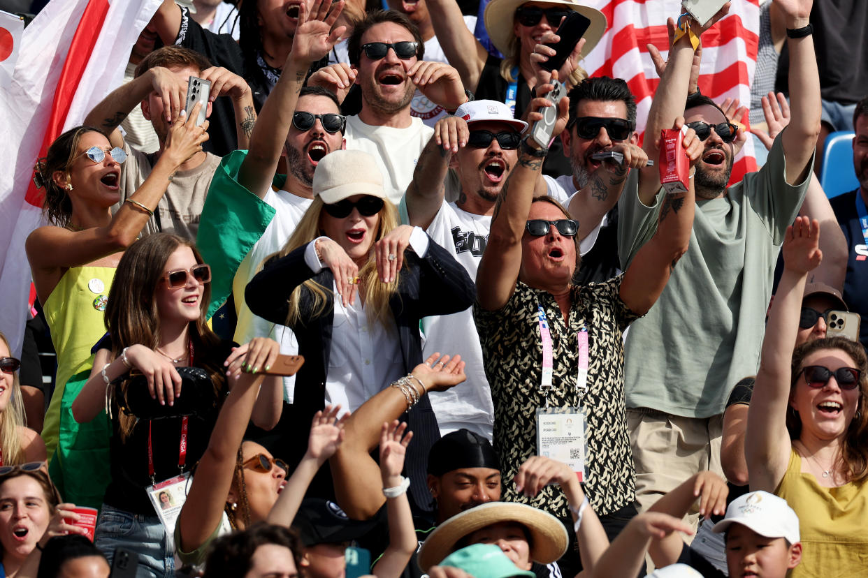 Nicole Kidman, with her husband, Keith Urban, and daughter Faith cheering at the Olympics.