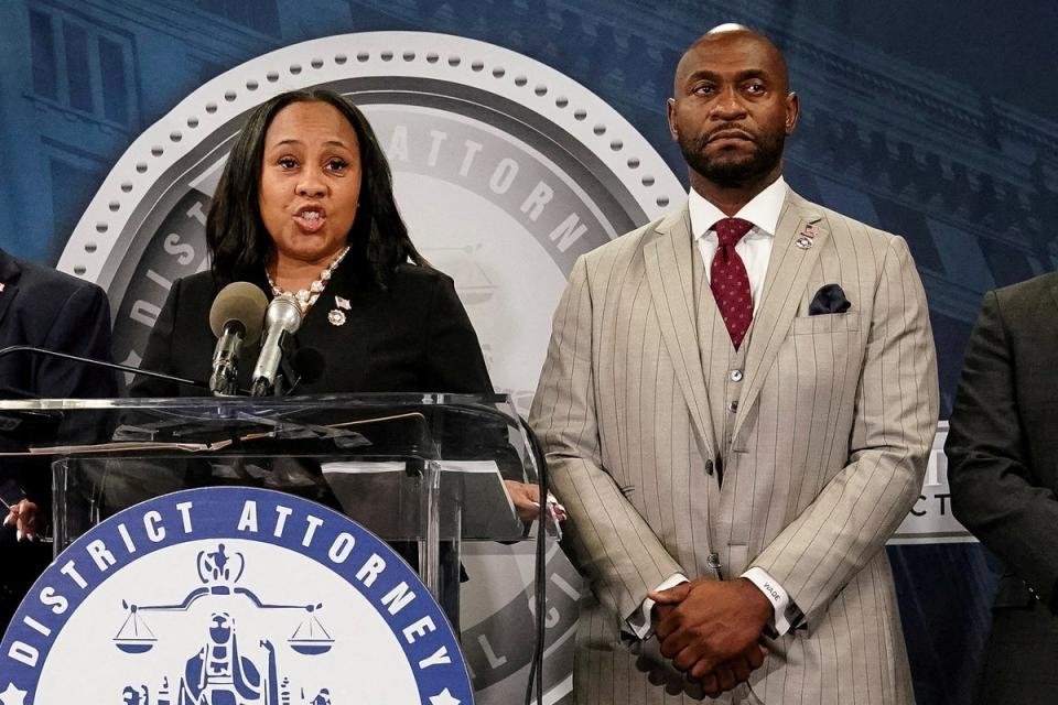 Fani Willis and prosecutor Nathan Wade speak to reporters after a grand jury returned an indictment against Donald Trump in August 2023. (Reuters)