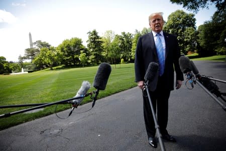 U.S. President Trump talks to reporters as he departs for travel to Louisiana from the White House in Washington