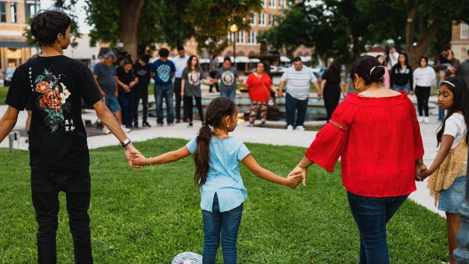 Members of the community gather at the city of Uvalde Town Square for a prayer vigil in the wake of a mass shooting at Robb Elementary School on May 24, 2022, in Uvalde, Texas.