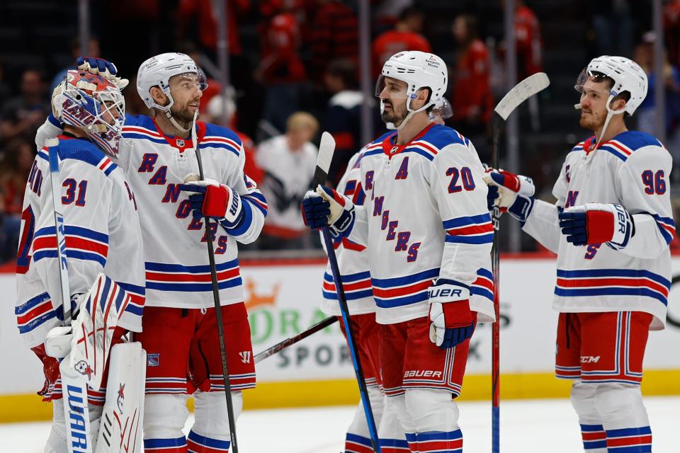 Apr 26, 2024; Washington, District of Columbia, USA; New York Rangers goaltender Igor Shesterkin (31) celebrates with teammates after their game against the Washington Capitals in game three of the first round of the 2024 Stanley Cup Playoffs at Capital One Arena.