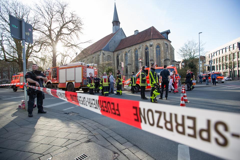 <p>An armed Police officer and first responders are seen at the scene when several people were killed and injured when a car ploughed into pedestrians in Muenster, western Germany on April 7, 2018. (Photo: Friso Gentsch/AFP/Getty Images) </p>