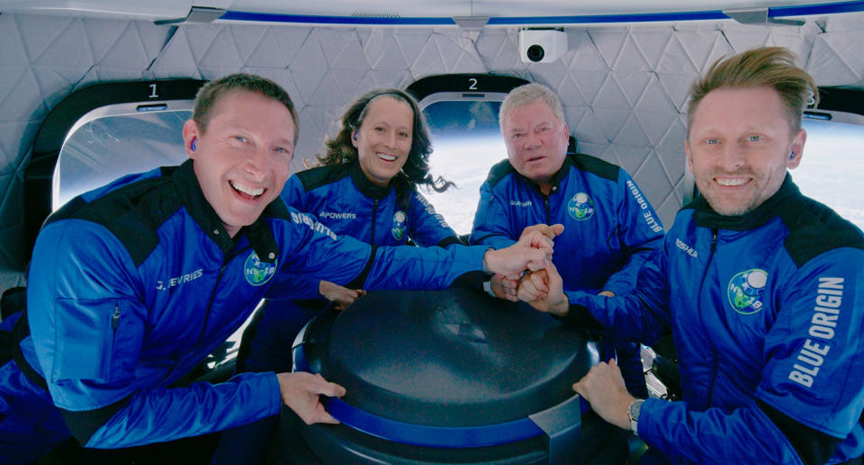 Glen de Vries (left) pictured on the Blue Origin's New Shepard rocket space with actor William Shatner (second from the right) last month.