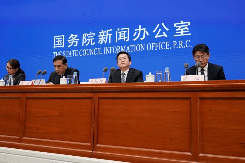 Chinese health officials at news conference in Beijing