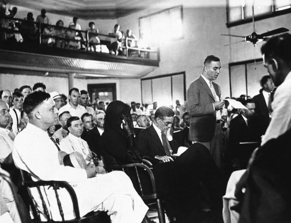 Libby Holman Reynolds, Broadway singer, is pictured in the Little Wentworth, North Carolina courtroom, Aug. 8, 1932, where she surrendered and was admitted to $25,000 bail to face a charge of killing her husband, Smith Reynolds, 20-year-old heir to tobacco millions. Young Reynolds was slain in his mansion in Winston Salem, N.C., July 6 and his widow and his chum, Al Walker, were indicted for his murder. Beside the young widow, heavily veiled and clad in black, is her father, Alfred Holman, Cincinnati lawyer, who is holding her hand. Standing beyond Holman is Libbys lawyer, Benet Polikoff, making his plea for her admission to bail. (AP Photo)