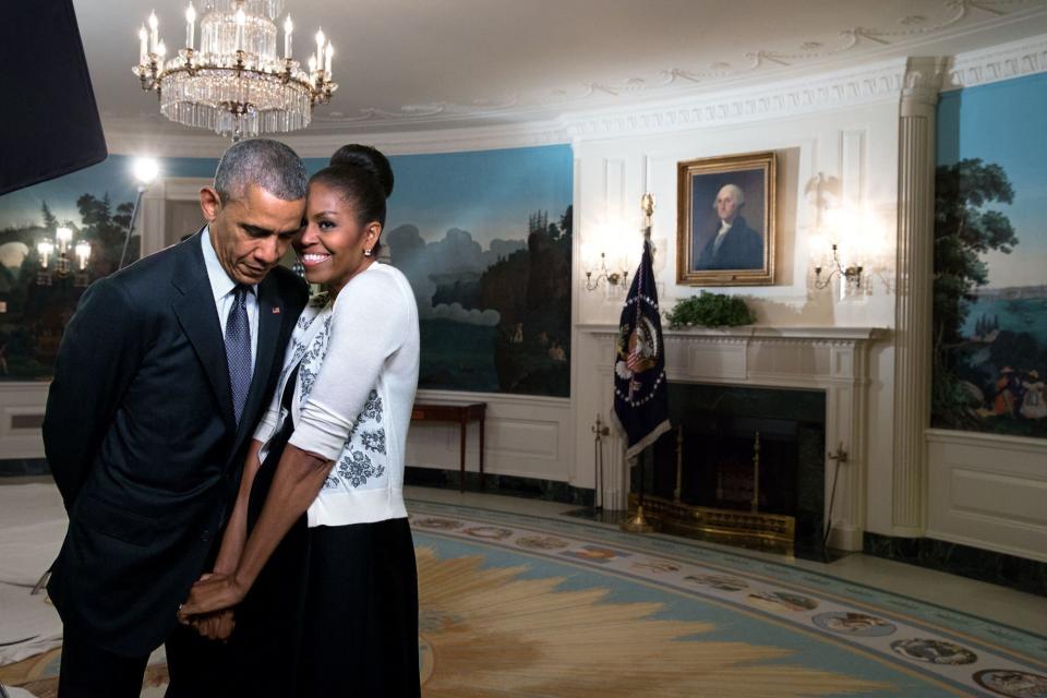 The first lady&nbsp;snuggles against the president during a videotaping for the 2015 World Expo in the Diplomatic Reception Room of the White House.