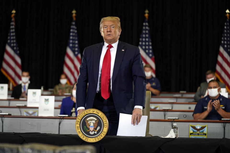 President Donald Trump stands after a briefing on counternarcotics operations at U.S. Southern Command, Friday, July 10, 2020, in Doral, Fla. (AP Photo/Evan Vucci)