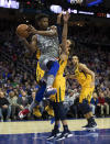 Philadelphia 76ers' Jimmy Butler, left, passes the ball while being guarded by Utah Jazz's Ricky Rubio, right, of Spain, during the first half of an NBA basketball game, Friday, Nov. 16, 2018, in Philadelphia. (AP Photo/Chris Szagola)