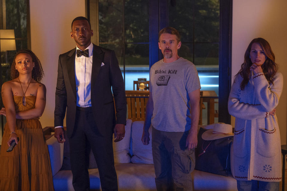 This image released by Netflix shows Myha'la Herrold, from left, Mahershala Ali, Ethan Hawke and Julia Roberts in a scene from "Leave the World Behind." (Netflix via AP)