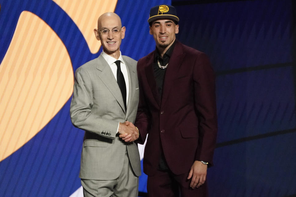 Chris Duarte, right, poses for a photo with NBA Commissioner Adam Silver after being selected as the 13th overall pick by the Indiana Pacers during the NBA basketball draft, Thursday, July 29, 2021, in New York. (AP Photo/Corey Sipkin)