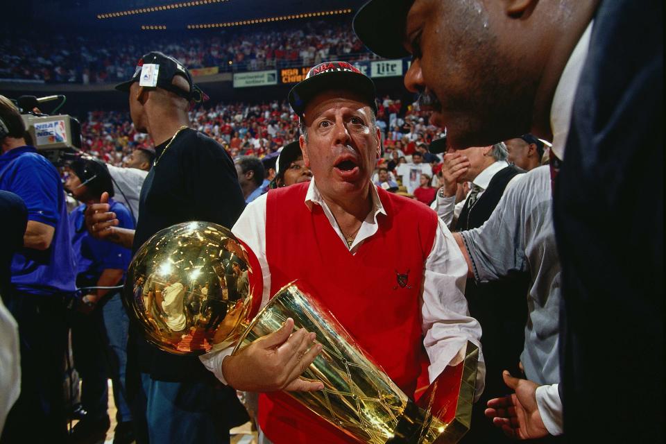Then-Houston Rockets owner Leslie Alexander holds onto the Larry O’Brien Championship Trophy after the Rockets’ NBA Finals victory in 1994. (Getty)