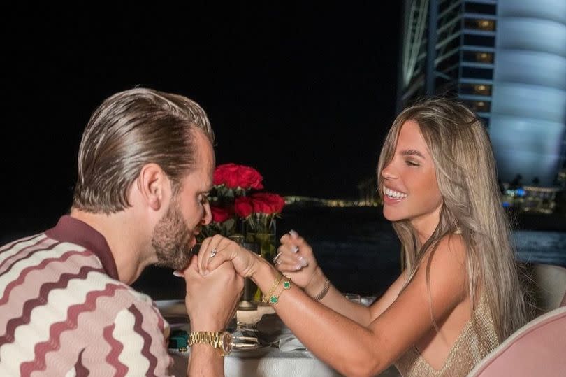 James asked Naomi to marry him during a romantic beach proposal in Dubai