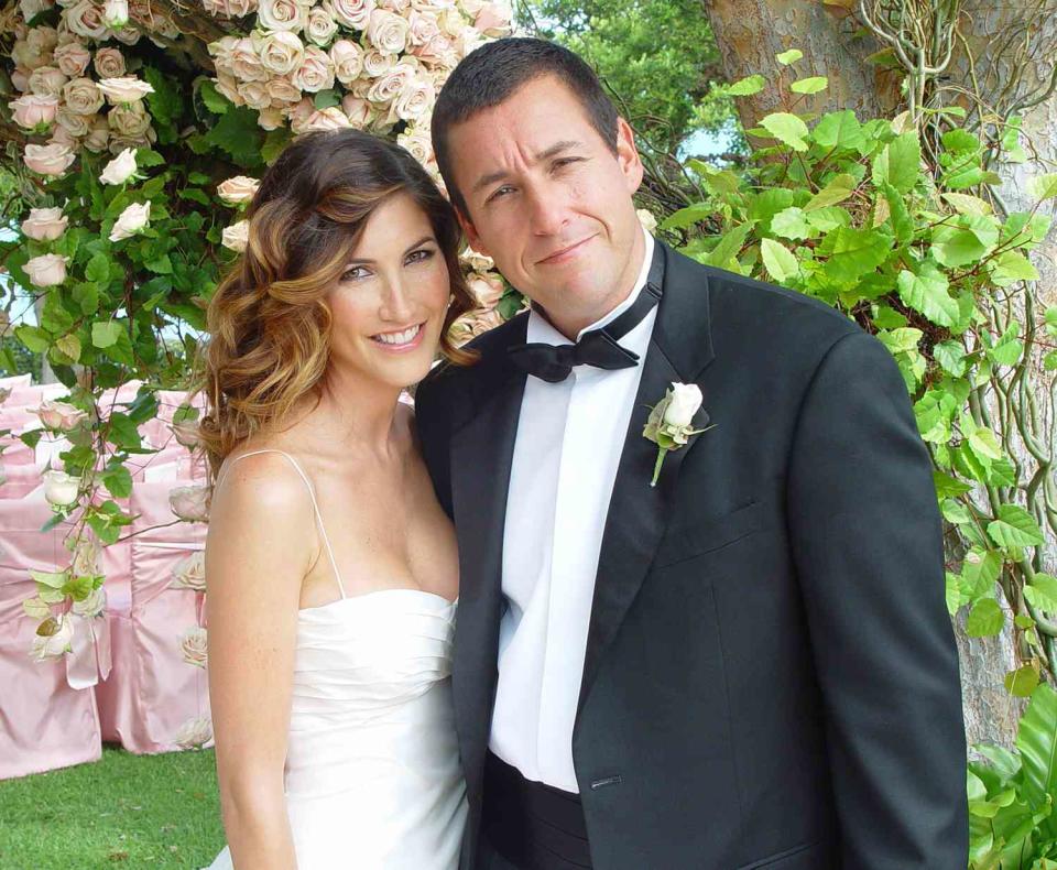 Adam Sandler poses with his bride model-actress Jackie Titone at their wedding June 22, 2003 in Malibu, California