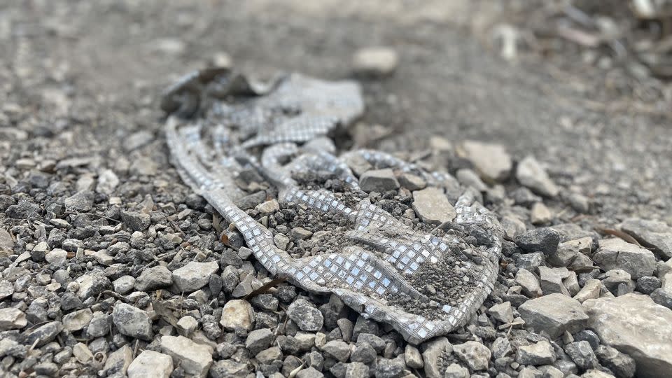 A sparkly sequin dress left over in the debris. - Rebecca Wright/CNN