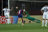 PSG's Kylian Mbappe scores his side's 3rd goal on a penalty kick during the Champions League quarterfinal second leg soccer match between Barcelona and Paris Saint-Germain at the Olimpic Lluis Companys stadium in Barcelona, Spain, Tuesday, April 16, 2024. (AP Photo/Joan Monfort)