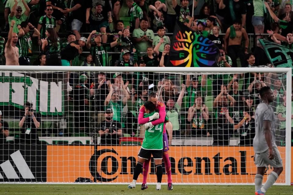 Austin FC goalkeeper Brad Stuver embraces defender Nick Lima after Saturday night's 1-0 win over CF Montreal at Q2 Stadium. El Tree improved to 1-1 and is on the front end of a five-match schedule over 14 days.