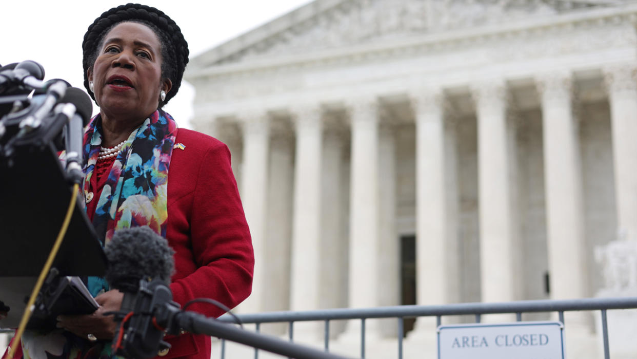 Rep. Sheila Jackson-Lee at a bank of microphones in front of the U.S. Supreme Court.