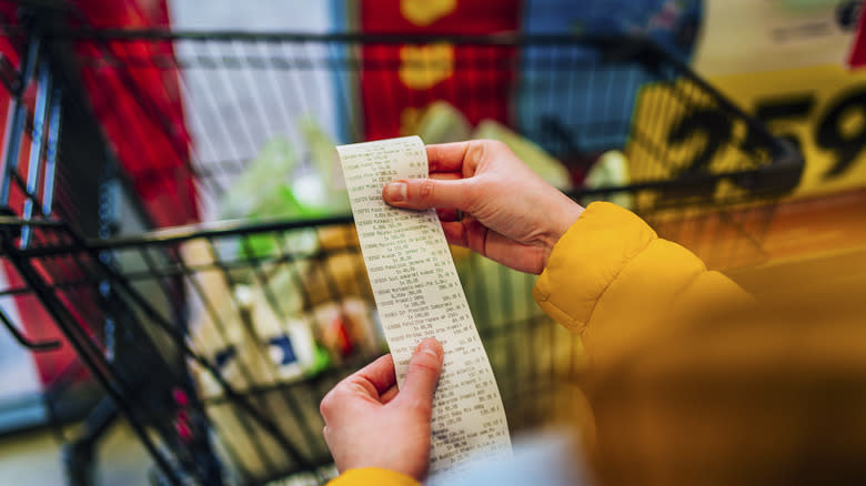 Person looking at receipt 