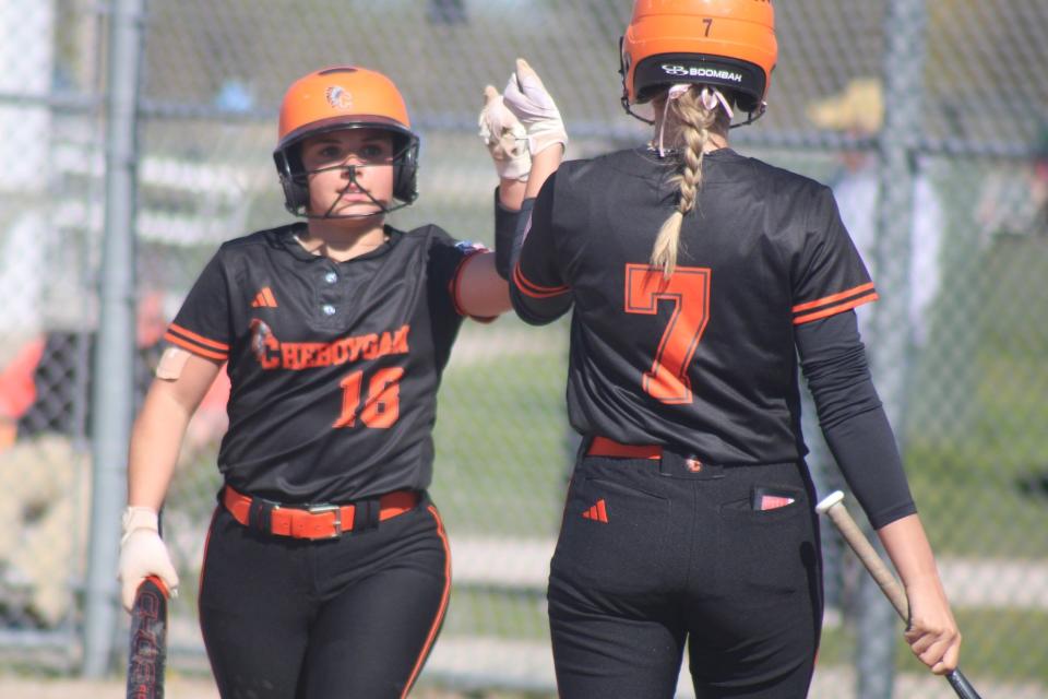 Presley Chamberlain (18) and Amelia Johnson (7) helped lift Cheboygan softball to a third straight Straits Area Conference title by sweeping Newberry on Monday.