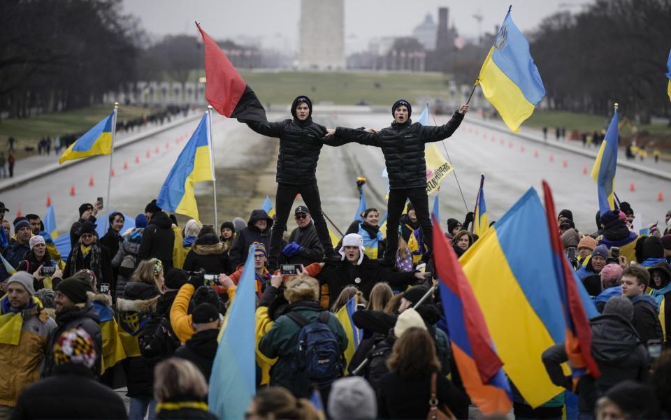 Supporters of Ukraine and members of the Ukrainian community hold a rally to mark the one-year anniversary of Russia's invasion of Ukraine, near the Lincoln Memoria - Drew Angerer/Getty Images North America