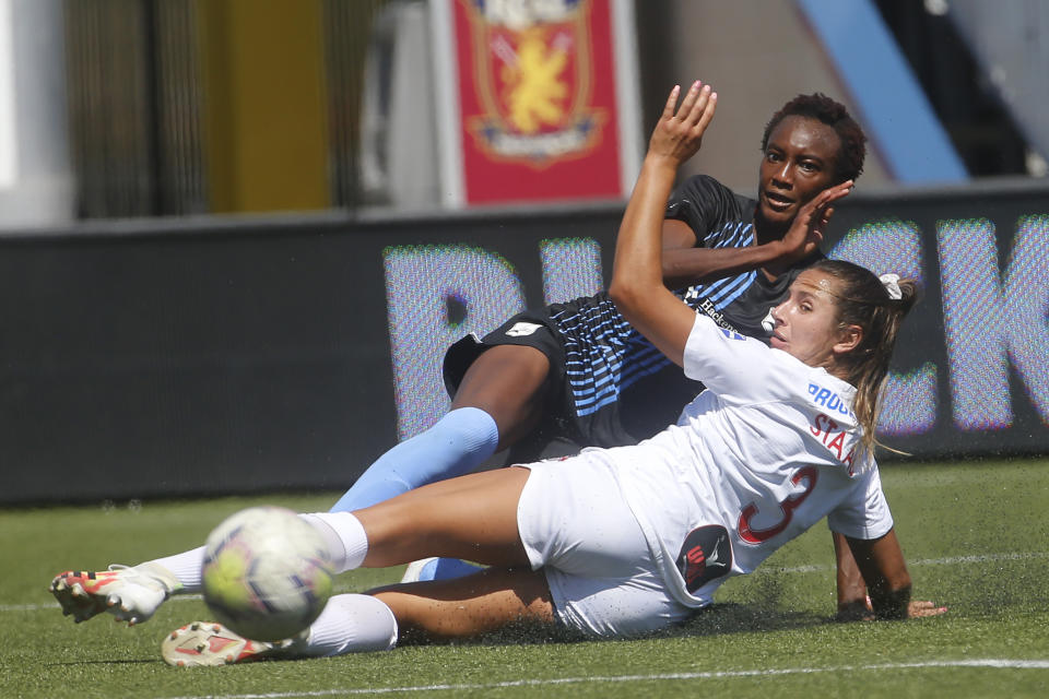 Sky Blue's Ifeoma Onumonu, rear, kicks the ball as Washington Spirit defender Sam Staab (3) defends during the first half of an NWSL Challenge Cup soccer match at Zions Bank Stadium Saturday, July 18, 2020, in Herriman, Utah. (AP Photo/Rick Bowmer)