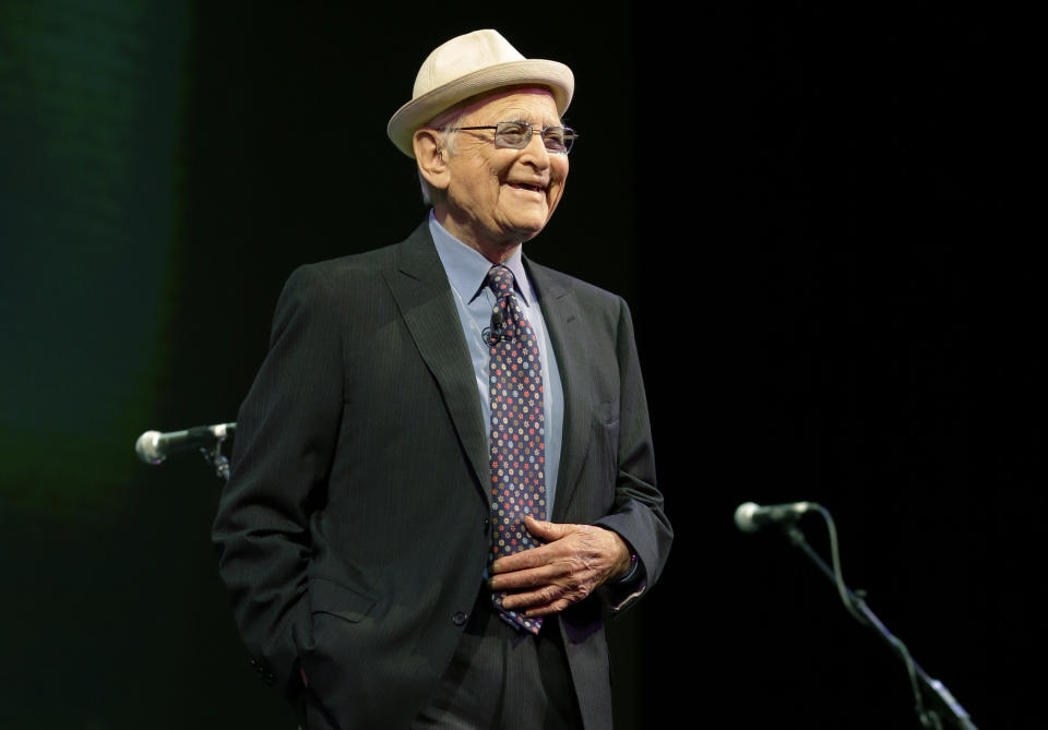 Norman Lear, television writer and producer, speaks at the opening of Starbucks Coffee Company's annual shareholders meeting, Wednesday, March 19, 2014, in Seattle. (AP Photo/Ted S. Warren)