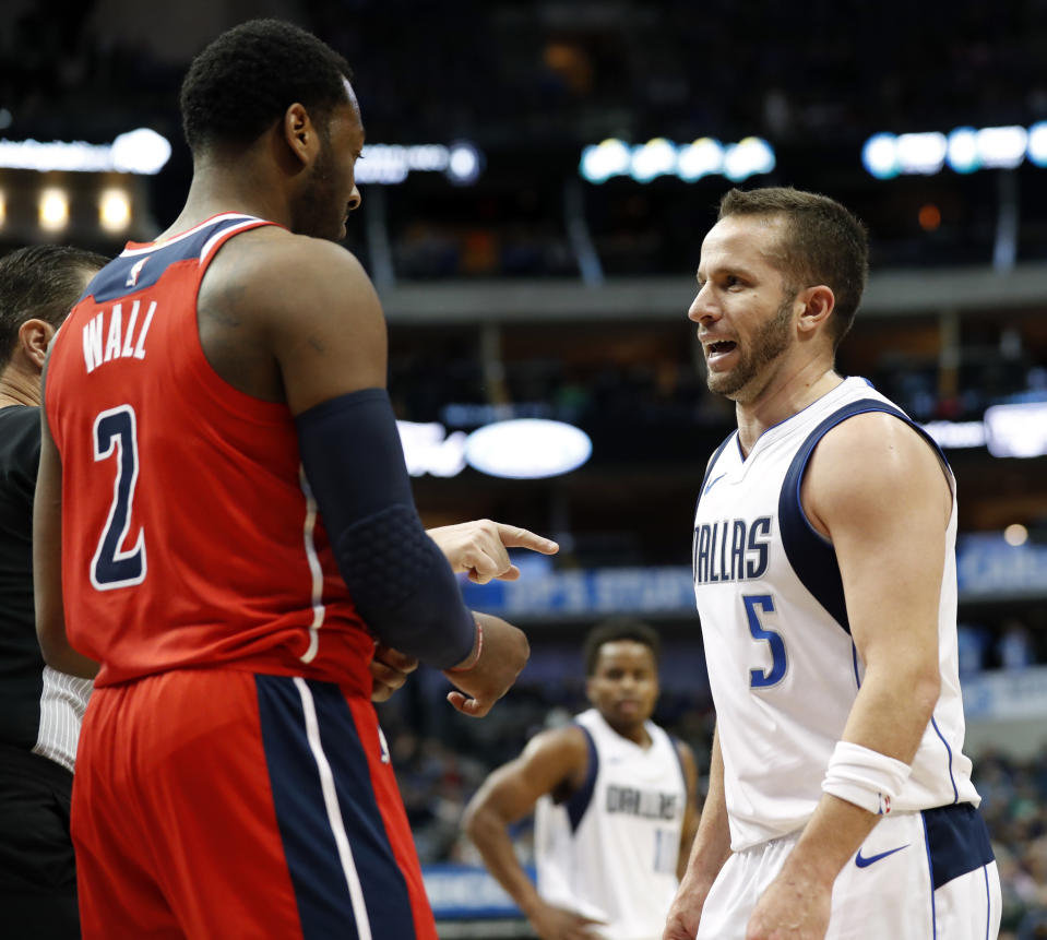 John Wall and J.J. Barea’s war of words started in the fourth quarter and carried over into the postgame. (AP)