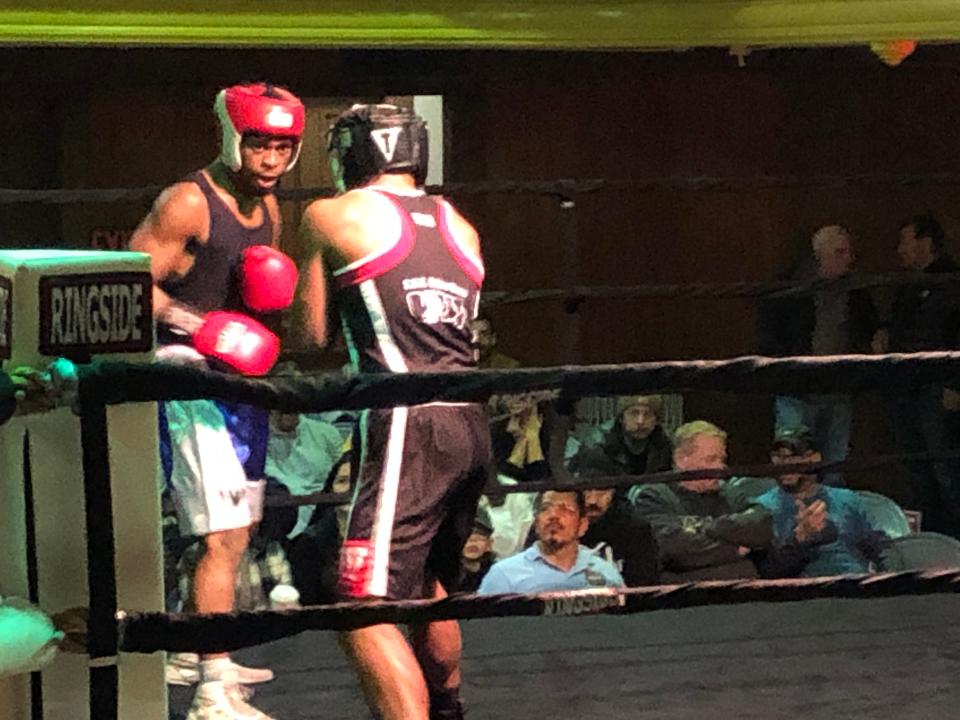 Christopher Rivera, left, of Punishment Striking Striking Systems in Swansea, looks to land a punch during his split decision win over Avant Hazard of the host Fall River PAL during their 165-pound novice bout Saturday at the Southern New England Golden Gloves at the Fall River PAL.