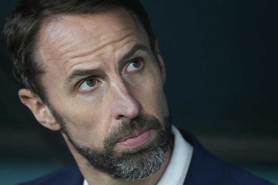 England's head coach Gareth Southgate sits at the bench prior the World Cup group B soccer match between England and Wales, at the Ahmad Bin Ali Stadium in Al Rayyan , Qatar, Tuesday, Nov. 29, 2022. (AP Photo/Frank Augstein)