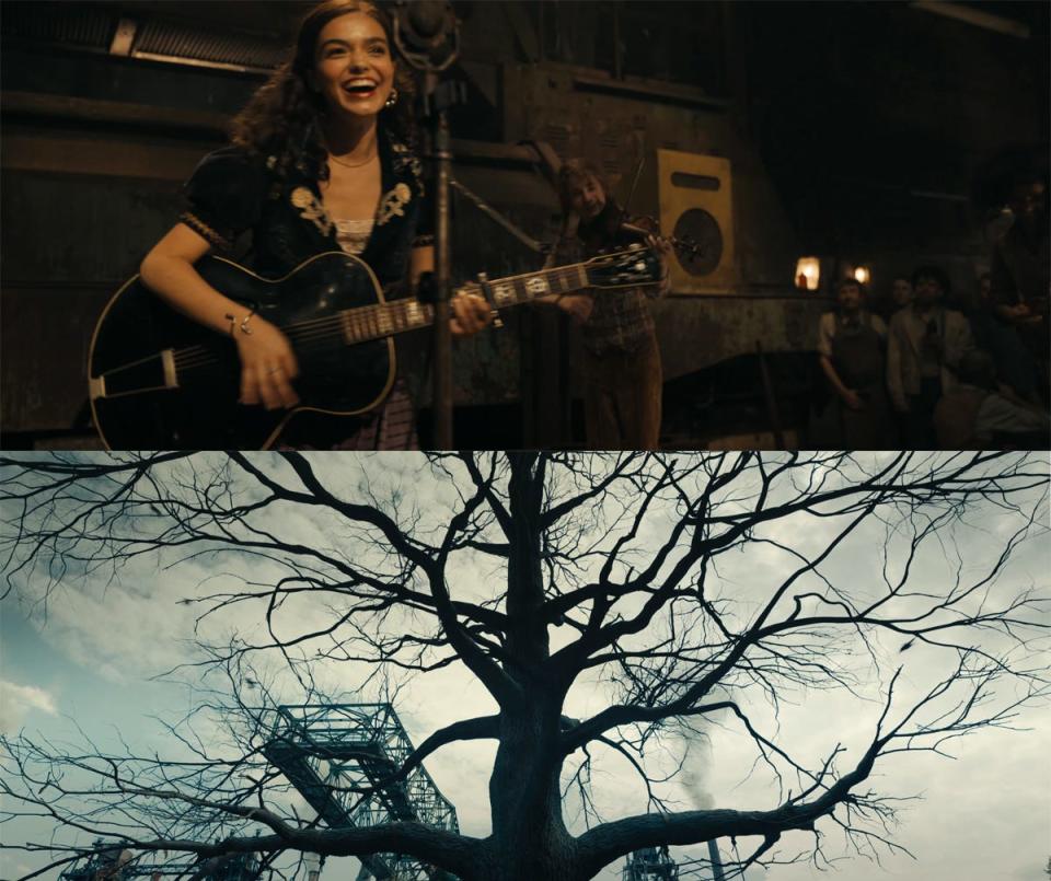 Lucy is seen singing and playing a guitar above the picture of "the hanging tree."