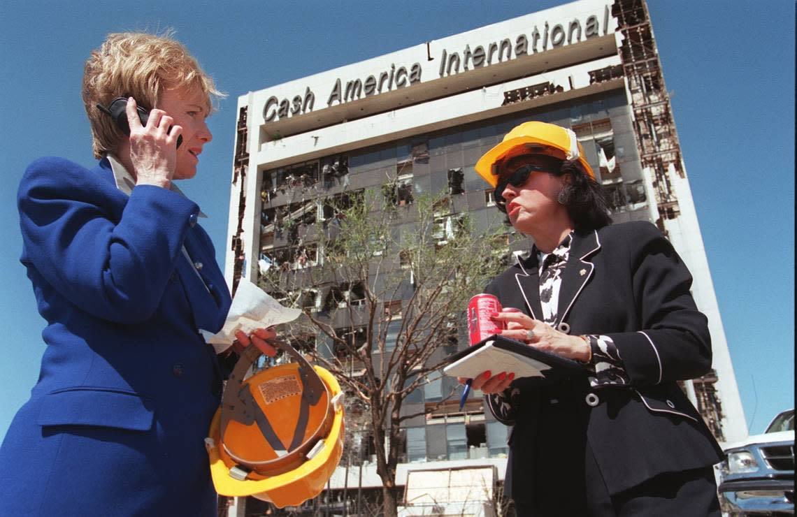 U.S. Rep. Kay Granger, with her district director Barbara A. Ragland, makes calls outside the Cash America International building where she had an office. A tornado on March 28, 2000, heavily damaged the building at 1600 W. Seventh St. near the Trinity River bridge. The building was later renovated and today is home to FirstCash.