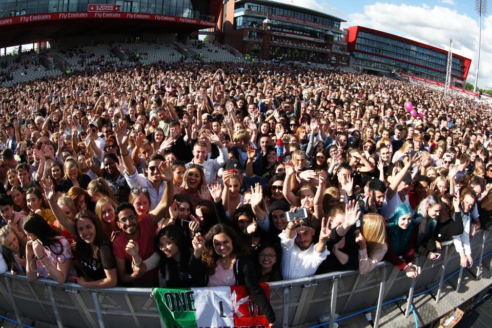 <p>Thousands packed into Old Trafford cricket ground for the one-off benefit concert . (Getty) </p>