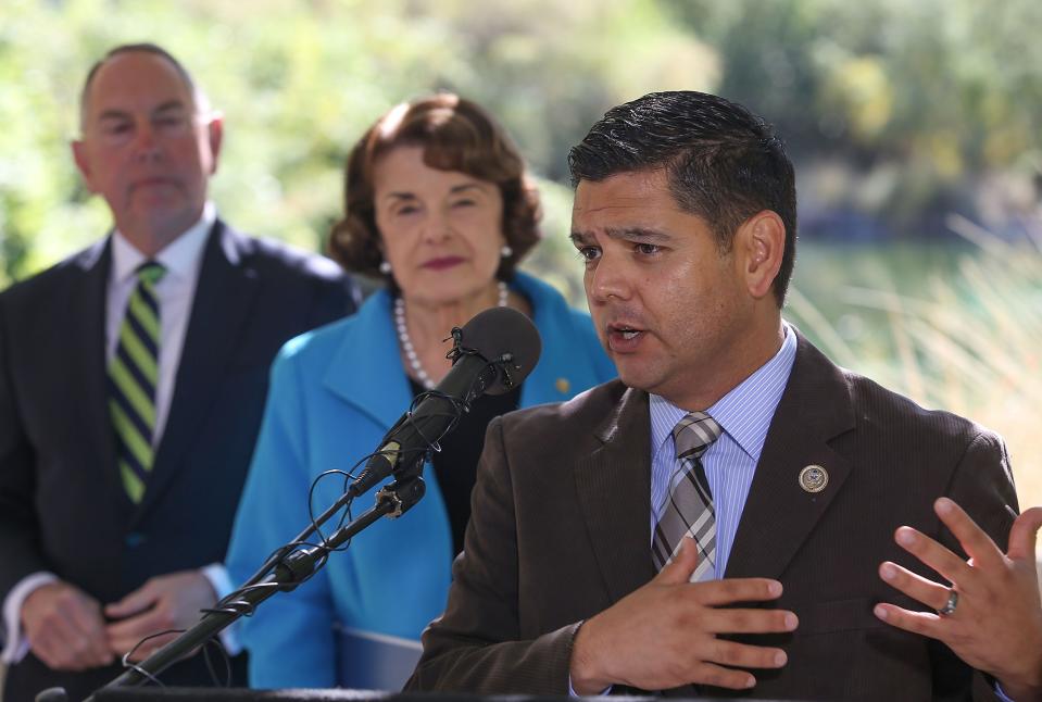 Raul Ruiz, right speaks as Sen. Dianne Feinstein and State Senator Richard Roth look on at the Whitewater Preserve, October 25, 2018.