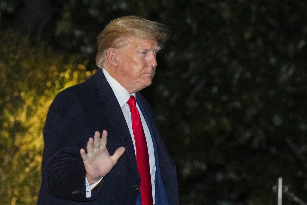 President Donald Trump waves as he leaves the White House on Monday: AP