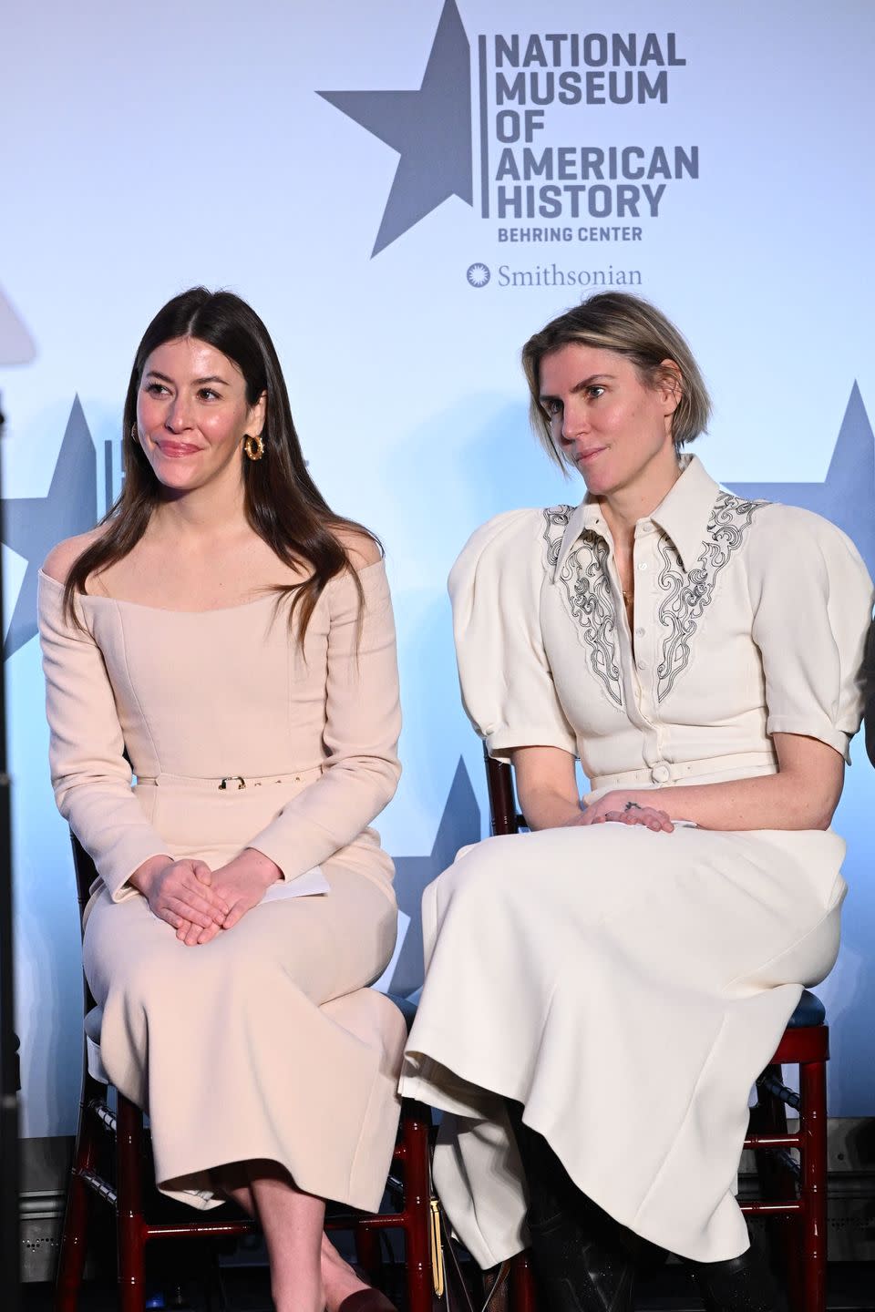 us fashion designer alexandra oneill and uruguayan us fashion designer gabriela hearst look on as us first lady jill biden, not pictured, speaks during the presentation of her 2021 inaugural ensembles to the smithsonians national museum of american history in washington, dc, on january 25, 2023 the blue wool tapered tweed dress with overcoat designed by alexandra oneill, and evening dress and coat by gabriela hearst, will be part of the first ladies exhibition at the museum photo by mandel ngan afp photo by mandel nganafp via getty images