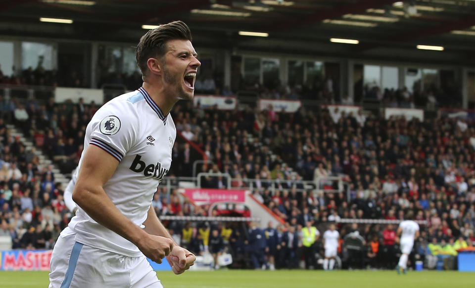 West Ham United's Aaron Cresswell celebrates scoring his side's second goal of the game against Bournemouth during their English Premier League soccer match at the Vitality Stadium in Bournemouth, England, Saturday, Sept. 28, 2019. (Mark Kerton/PA via AP)