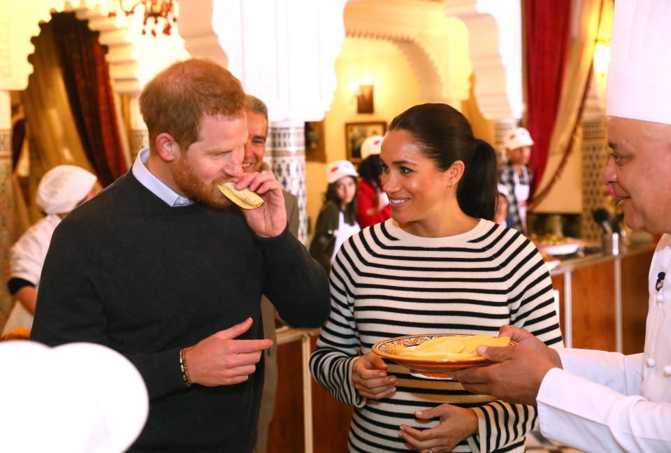 The Duke and Duchess of Sussex try some food during a cooking school demonstration at Villa des Ambassadors in Rabat on the third day of their tour of Morocco.