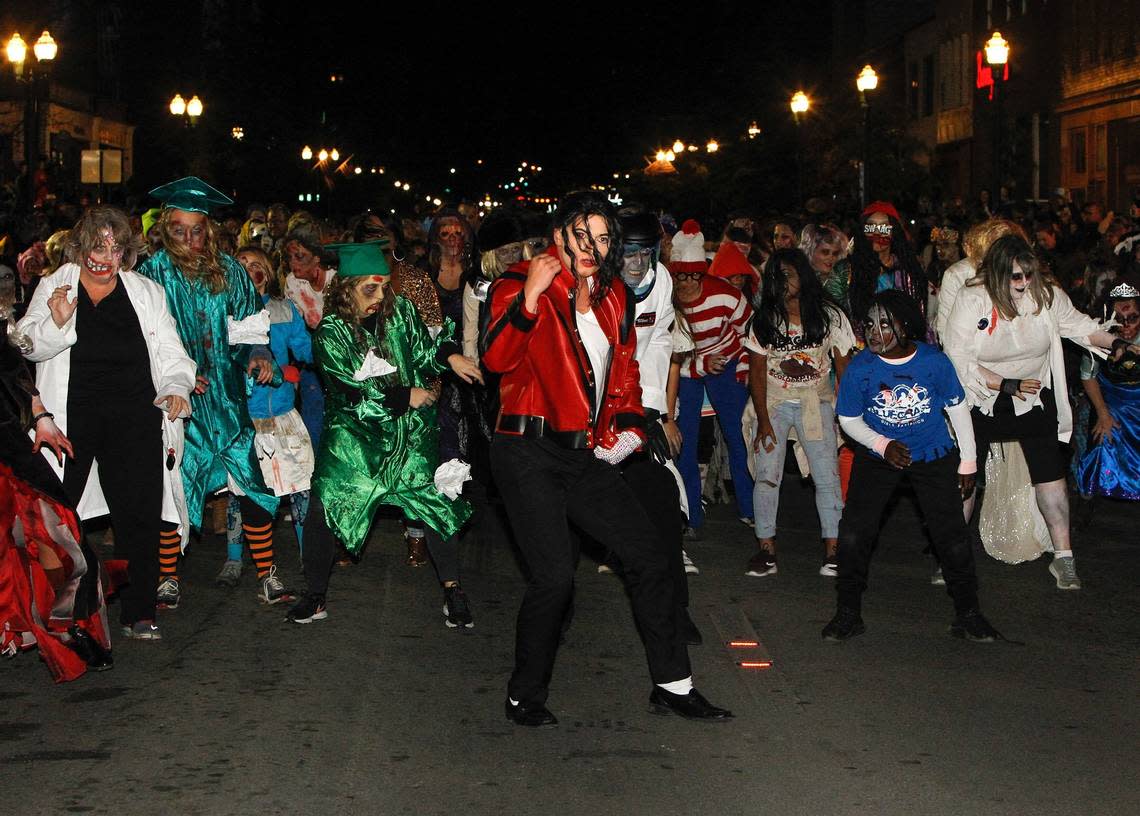 Hundreds of people participate in Lexington’s annual “Thriller” dance, parade and other Halloween events downtown. Matt Goins