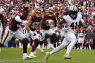 FILE - New Orleans Saints running back Alvin Kamara (41) rushes for a touchdown against the Washington Football Team in the first half of an NFL football game in Landover, Md., in this Sunday, Oct. 10, 2021, file photo. The Kansas City Chiefs and Washington head into their matchup this weekend as two of the worst defenses in the NFL. No teams have allowed more points this season and they're both coming off allowing 30-plus points last week.(AP Photo/Alex Brandon, File)